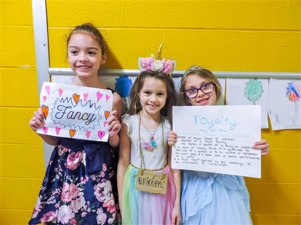 Students and teachers dressing up for a vocabulary parade. 